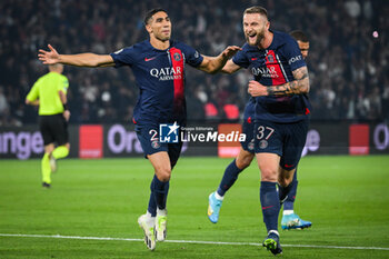 2023-09-24 - Achraf HAKIMI of PSG celebrate his goal with Milan SKRINIAR of PSG during the French championship Ligue 1 football match between Paris Saint-Germain and Olympique de Marseille on September 24, 2023 at Parc des Princes stadium in Paris, France - FOOTBALL - FRENCH CHAMP - PARIS SG V MARSEILLE - FRENCH LIGUE 1 - SOCCER