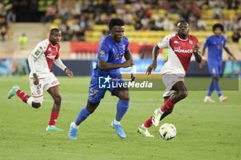 2023-09-22 - Youssouf Ndayishimiye of Nice between Mohamed Camara and Youssouf Fofana of Monaco during the French championship Ligue 1 football match between AS Monaco and OGC Nice on September 22, 2023 at Stade Louis II in Monaco - FOOTBALL - FRENCH CHAMP - MONACO V NICE - FRENCH LIGUE 1 - SOCCER