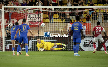 2023-09-22 - Nice goalkeeper Marcin Bulka stops the penalty kick of Folarin Balogun of Monaco (right) during the French championship Ligue 1 football match between AS Monaco and OGC Nice on September 22, 2023 at Stade Louis II in Monaco - FOOTBALL - FRENCH CHAMP - MONACO V NICE - FRENCH LIGUE 1 - SOCCER