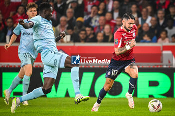 2023-09-26 - Joseph OKUMU of Reims and Remy CABELLA of Lille during the French championship Ligue 1 football match between LOSC Lille and Stade de Reims on September 26, 2023 at Pierre Mauroy stadium in Villeneuve-d'Ascq near Lille, France - FOOTBALL - FRENCH CHAMP - LILLE V REIMS - FRENCH LIGUE 1 - SOCCER