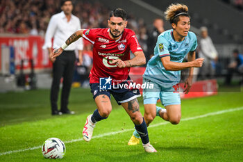 2023-09-26 - Remy CABELLA of Lille and Keito NAKAMURA of Reims during the French championship Ligue 1 football match between LOSC Lille and Stade de Reims on September 26, 2023 at Pierre Mauroy stadium in Villeneuve-d'Ascq near Lille, France - FOOTBALL - FRENCH CHAMP - LILLE V REIMS - FRENCH LIGUE 1 - SOCCER