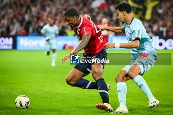 2023-09-26 - Alexsandro VICTOR DE SOUZA RIBEIRO of Lille and Amine SALAMA of Reims during the French championship Ligue 1 football match between LOSC Lille and Stade de Reims on September 26, 2023 at Pierre Mauroy stadium in Villeneuve-d'Ascq near Lille, France - FOOTBALL - FRENCH CHAMP - LILLE V REIMS - FRENCH LIGUE 1 - SOCCER