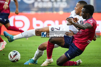 2023-09-30 - Cheick OUMAR KONATE of Clermont and Kylian MBAPPE of PSG during the French championship Ligue 1 football match between Clermont Foot 63 and Paris Saint-Germain on September 30, 2023 at Gabriel-Montpied stadium in Clermont-Ferrand, France - FOOTBALL - FRENCH CHAMP - CLERMONT V PARIS SG - FRENCH LIGUE 1 - SOCCER