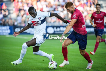 2023-09-30 - Randal KOLO MUANI of PSG and Maximiliano CAUFRIEZ of Clermont during the French championship Ligue 1 football match between Clermont Foot 63 and Paris Saint-Germain on September 30, 2023 at Gabriel-Montpied stadium in Clermont-Ferrand, France - FOOTBALL - FRENCH CHAMP - CLERMONT V PARIS SG - FRENCH LIGUE 1 - SOCCER