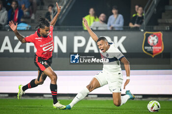 2023-10-08 - Lorenz ASSIGNON of Rennes and Kylian MBAPPE of PSG during the French championship Ligue 1 football match between Stade Rennais (Rennes) and Paris Saint-Germain on October 8, 2023 at Roazhon Park in Rennes, France - FOOTBALL - FRENCH CHAMP - RENNES V PARIS SG - FRENCH LIGUE 1 - SOCCER