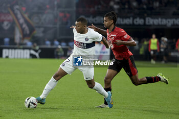 2023-10-08 - Kylian Mbappe of PSG, Lorenz Assignon of Rennes during the French championship Ligue 1 football match between Stade Rennais (Rennes) and Paris Saint-Germain on October 8, 2023 at Roazhon Park in Rennes, France - FOOTBALL - FRENCH CHAMP - RENNES V PARIS SG - FRENCH LIGUE 1 - SOCCER