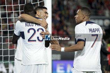 2023-10-08 - Randal Kolo Muani of PSG celebrates his goal with Achraf Hakimi and Kylian Mbappe of PSG during the French championship Ligue 1 football match between Stade Rennais (Rennes) and Paris Saint-Germain on October 8, 2023 at Roazhon Park in Rennes, France - FOOTBALL - FRENCH CHAMP - RENNES V PARIS SG - FRENCH LIGUE 1 - SOCCER