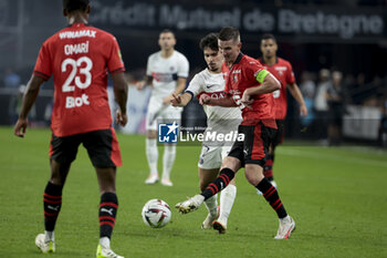 2023-10-08 - Benjamin Bourigeaud of Rennes, Vitinha of PSG during the French championship Ligue 1 football match between Stade Rennais (Rennes) and Paris Saint-Germain on October 8, 2023 at Roazhon Park in Rennes, France - FOOTBALL - FRENCH CHAMP - RENNES V PARIS SG - FRENCH LIGUE 1 - SOCCER