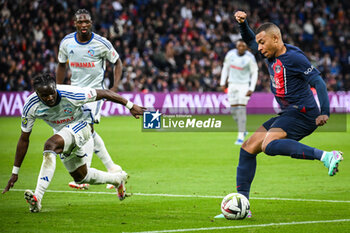2023-10-21 - Marvin SENAYA of Strasbourg and Kylian MBAPPE of PSG during the French championship Ligue 1 football match between Paris Saint-Germain and RC Strasbourg on October 21, 2023 at Parc des Princes stadium in Paris, France - FOOTBALL - FRENCH CHAMP - PARIS SG V STRASBOURG - FRENCH LIGUE 1 - SOCCER