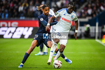 2023-10-21 - Bradley BARCOLA of PSG and Marvin SENAYA of Strasbourg during the French championship Ligue 1 football match between Paris Saint-Germain and RC Strasbourg on October 21, 2023 at Parc des Princes stadium in Paris, France - FOOTBALL - FRENCH CHAMP - PARIS SG V STRASBOURG - FRENCH LIGUE 1 - SOCCER