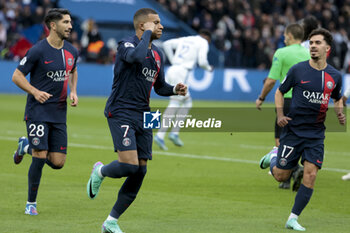 2023-10-21 - Kylian Mbappe of PSG celebrates his goal with Carlos Soler, Vitinha during the French championship Ligue 1 football match between Paris Saint-Germain and RC Strasbourg on October 21, 2023 at Parc des Princes stadium in Paris, France - FOOTBALL - FRENCH CHAMP - PARIS SG V STRASBOURG - FRENCH LIGUE 1 - SOCCER