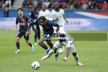 2023-10-21 - Bradley Barcola of PSG, Marvin Senaya of Strasbourg during the French championship Ligue 1 football match between Paris Saint-Germain and RC Strasbourg on October 21, 2023 at Parc des Princes stadium in Paris, France - FOOTBALL - FRENCH CHAMP - PARIS SG V STRASBOURG - FRENCH LIGUE 1 - SOCCER