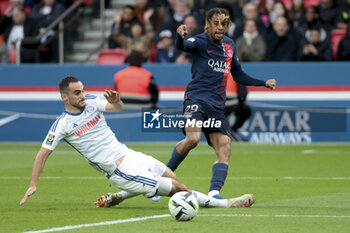 2023-10-21 - Bradley Barcola of PSG, left Lucas Perrin of Strasbourg during the French championship Ligue 1 football match between Paris Saint-Germain and RC Strasbourg on October 21, 2023 at Parc des Princes stadium in Paris, France - FOOTBALL - FRENCH CHAMP - PARIS SG V STRASBOURG - FRENCH LIGUE 1 - SOCCER