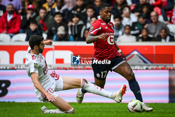 2023-10-22 - Pierre LEES-MELOU of Brest and Ivan CAVALEIRO of Lille during the French championship Ligue 1 football match between Losc Lille and Stade Brestois (Brest) on October 22, 2023 at Pierre Mauroy stadium in Villeneuve-d'Ascq near Lille, France - FOOTBALL - FRENCH CHAMP - LILLE V BREST - FRENCH LIGUE 1 - SOCCER