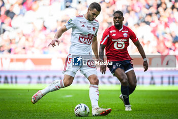 2023-10-22 - Brendan CHARDONNET of Brest and Ivan CAVALEIRO of Lille during the French championship Ligue 1 football match between Losc Lille and Stade Brestois (Brest) on October 22, 2023 at Pierre Mauroy stadium in Villeneuve-d'Ascq near Lille, France - FOOTBALL - FRENCH CHAMP - LILLE V BREST - FRENCH LIGUE 1 - SOCCER