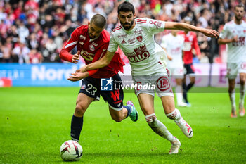2023-10-22 - Edon ZHEGROVA of Lille and Pierre LEES-MELOU of Brest during the French championship Ligue 1 football match between Losc Lille and Stade Brestois (Brest) on October 22, 2023 at Pierre Mauroy stadium in Villeneuve-d'Ascq near Lille, France - FOOTBALL - FRENCH CHAMP - LILLE V BREST - FRENCH LIGUE 1 - SOCCER