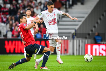2023-10-22 - Benjamin ANDRE of Lille and Jonas MARTIN of Brest during the French championship Ligue 1 football match between Losc Lille and Stade Brestois (Brest) on October 22, 2023 at Pierre Mauroy stadium in Villeneuve-d'Ascq near Lille, France - FOOTBALL - FRENCH CHAMP - LILLE V BREST - FRENCH LIGUE 1 - SOCCER