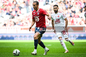 2023-10-22 - Yusuf YAZICI of Lille and Romain DEL CASTILLO of Brest during the French championship Ligue 1 football match between Losc Lille and Stade Brestois (Brest) on October 22, 2023 at Pierre Mauroy stadium in Villeneuve-d'Ascq near Lille, France - FOOTBALL - FRENCH CHAMP - LILLE V BREST - FRENCH LIGUE 1 - SOCCER