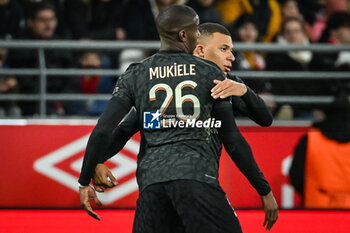 2023-11-11 - Kylian MBAPPE of PSG celebrate his goal with Nordi MUKIELE of PSG during the French championship Ligue 1 football match between Stade de Reims and Paris Saint-Germain on November 11, 2023 at Auguste Delaune stadium in Reims, France - FOOTBALL - FRENCH CHAMP - REIMS V PARIS SG - FRENCH LIGUE 1 - SOCCER