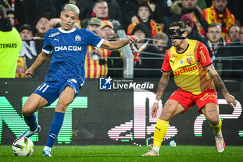 2023-11-12 - Amine HARIT of Marseille and Ruben AGUILAR of Lens during the French championship Ligue 1 football match between RC Lens and Olympique de Marseille on November 12, 2023 at Bollaert-Delelis stadium in Lens, France - FOOTBALL - FRENCH CHAMP - LENS V MARSEILLE - FRENCH LIGUE 1 - SOCCER