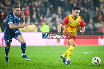 2023-11-12 - Jordan VERETOUT of Marseille and Adrien THOMASSON of Lens during the French championship Ligue 1 football match between RC Lens and Olympique de Marseille on November 12, 2023 at Bollaert-Delelis stadium in Lens, France - FOOTBALL - FRENCH CHAMP - LENS V MARSEILLE - FRENCH LIGUE 1 - SOCCER