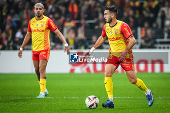 2023-11-12 - Facundo Axel MEDINA of Lens and Adrien THOMASSON of Lens during the French championship Ligue 1 football match between RC Lens and Olympique de Marseille on November 12, 2023 at Bollaert-Delelis stadium in Lens, France - FOOTBALL - FRENCH CHAMP - LENS V MARSEILLE - FRENCH LIGUE 1 - SOCCER
