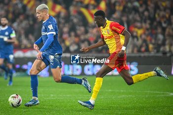 2023-11-12 - Amine HARIT of Marseille and Salis Abdul SAMED of Lens during the French championship Ligue 1 football match between RC Lens and Olympique de Marseille on November 12, 2023 at Bollaert-Delelis stadium in Lens, France - FOOTBALL - FRENCH CHAMP - LENS V MARSEILLE - FRENCH LIGUE 1 - SOCCER