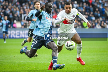 2023-12-03 - Arouna SANGANTE of Le Havre AC and Kylian MBAPPE of PSG during the French championship Ligue 1 football match between Le Havre AC and Paris Saint-Germain on December 3, 2023 at Oceane stadium in Le Havre, France - FOOTBALL - FRENCH CHAMP - LE HAVRE V PARIS SG - FRENCH LIGUE 1 - SOCCER