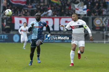 2023-12-03 - Arouna Sangante of Le Havre, Kylian Mbappe of PSG in action during the French championship Ligue 1 football match between Le Havre AC and Paris Saint-Germain on December 3, 2023 at Oceane stadium in Le Havre, France - FOOTBALL - FRENCH CHAMP - LE HAVRE V PARIS SG - FRENCH LIGUE 1 - SOCCER