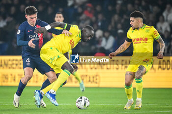 2023-12-09 - Manuel UGARTE of PSG, Moussa SISSOKO of Nantes and Douglas AUGUSTO of Nantes during the French championship Ligue 1 football match between Paris Saint-Germain and FC Nantes on December 9, 2023 at Parc des Princes stadium in Paris, France - FOOTBALL - FRENCH CHAMP - PARIS SG V NANTES - FRENCH LIGUE 1 - SOCCER