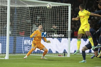 2023-12-09 - Mostafa Mohamed of Nantes scores his goal against PSG goalkeeper Arnau Tenas during the French championship Ligue 1 football match between Paris Saint-Germain and FC Nantes on December 9, 2023 at Parc des Princes stadium in Paris, France - FOOTBALL - FRENCH CHAMP - PARIS SG V NANTES - FRENCH LIGUE 1 - SOCCER