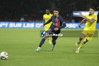 2023-12-09 - Warren Zaire-Emery of PSG, Douglas Augusto of Nantes during the French championship Ligue 1 football match between Paris Saint-Germain and FC Nantes on December 9, 2023 at Parc des Princes stadium in Paris, France - FOOTBALL - FRENCH CHAMP - PARIS SG V NANTES - FRENCH LIGUE 1 - SOCCER