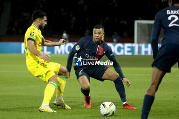 2023-12-09 - Kylian Mbappe of PSG, left Eray Comert of Nantes during the French championship Ligue 1 football match between Paris Saint-Germain and FC Nantes on December 9, 2023 at Parc des Princes stadium in Paris, France - FOOTBALL - FRENCH CHAMP - PARIS SG V NANTES - FRENCH LIGUE 1 - SOCCER