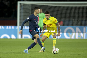 2023-12-09 - Achraf Hakimi of PSG, Douglas Augusto of Nantes during the French championship Ligue 1 football match between Paris Saint-Germain and FC Nantes on December 9, 2023 at Parc des Princes stadium in Paris, France - FOOTBALL - FRENCH CHAMP - PARIS SG V NANTES - FRENCH LIGUE 1 - SOCCER