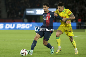 2023-12-09 - Warren Zaire-Emery of PSG, Douglas Augusto of Nantes during the French championship Ligue 1 football match between Paris Saint-Germain and FC Nantes on December 9, 2023 at Parc des Princes stadium in Paris, France - FOOTBALL - FRENCH CHAMP - PARIS SG V NANTES - FRENCH LIGUE 1 - SOCCER