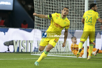 2023-12-09 - Mostafa Mohamed of Nantes celebrates his goal during the French championship Ligue 1 football match between Paris Saint-Germain and FC Nantes on December 9, 2023 at Parc des Princes stadium in Paris, France - FOOTBALL - FRENCH CHAMP - PARIS SG V NANTES - FRENCH LIGUE 1 - SOCCER