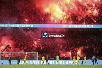 2023-12-09 - Flares and fireworks from the supporters of PSG during the French championship Ligue 1 football match between Paris Saint-Germain and FC Nantes on December 9, 2023 at Parc des Princes stadium in Paris, France - FOOTBALL - FRENCH CHAMP - PARIS SG V NANTES - FRENCH LIGUE 1 - SOCCER