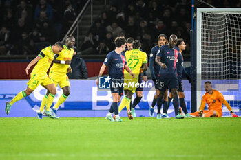 2023-12-09 - Mostafa MOHAMED of Nantes celebrate his goal with teammates and players of PSG look dejected during the French championship Ligue 1 football match between Paris Saint-Germain and FC Nantes on December 9, 2023 at Parc des Princes stadium in Paris, France - FOOTBALL - FRENCH CHAMP - PARIS SG V NANTES - FRENCH LIGUE 1 - SOCCER