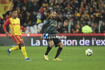 2023-12-16 - Yunis Abdelhamid of Reims, left Oscar Cortes of Lens during the French championship Ligue 1 football match between RC Lens ans Stade de Reims on December 16, 2023 at Bollaert-Delelis stadium in Lens, France - FOOTBALL - FRENCH CHAMP - LENS V REIMS - FRENCH LIGUE 1 - SOCCER