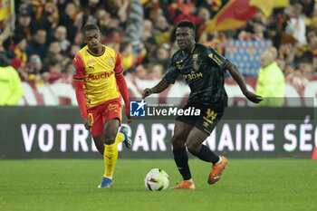 2023-12-16 - Azor Matusiwa of Reims, left David Pereira Da Costa of Lens during the French championship Ligue 1 football match between RC Lens ans Stade de Reims on December 16, 2023 at Bollaert-Delelis stadium in Lens, France - FOOTBALL - FRENCH CHAMP - LENS V REIMS - FRENCH LIGUE 1 - SOCCER