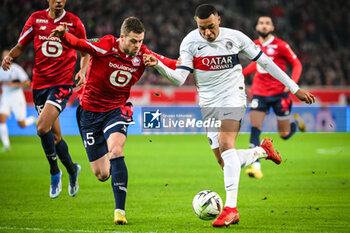 2023-12-17 - Gabriel GUDMUNDSSON of Lille and Kylian MBAPPE of PSG during the French championship Ligue 1 football match between Losc Lille and Paris Saint-Germain on December 17, 2023 at Pierre Mauroy stadium in Villeneuve-d'Ascq near Lille, France - FOOTBALL - FRENCH CHAMP - LILLE V PARIS SG - FRENCH LIGUE 1 - SOCCER