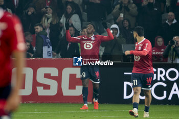 2023-12-17 - Jonathan David of Lille celebrates his goal during the French championship Ligue 1 football match between Losc Lille and Paris Saint-Germain on December 17, 2023 at Pierre Mauroy stadium in Villeneuve-d'Ascq near Lille, France - FOOTBALL - FRENCH CHAMP - LILLE V PARIS SG - FRENCH LIGUE 1 - SOCCER