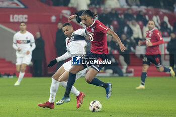 2023-12-17 - Kylian Mbappe of PSG, Leny Yoro of Lille during the French championship Ligue 1 football match between Losc Lille and Paris Saint-Germain on December 17, 2023 at Pierre Mauroy stadium in Villeneuve-d'Ascq near Lille, France - FOOTBALL - FRENCH CHAMP - LILLE V PARIS SG - FRENCH LIGUE 1 - SOCCER