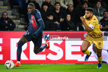 2023-12-20 - Randal KOLO MUANI of PSG and Matthieu UDOL of Metz during the French championship Ligue 1 football match between Paris Saint-Germain and FC Metz on December 20, 2023 at Parc des Princes stadium in Paris, France - FOOTBALL - FRENCH CHAMP - PARIS SG V METZ - FRENCH LIGUE 1 - SOCCER