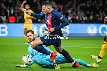 2023-12-20 - Alexandre OUKIDJA of Metz and Kylian MBAPPE of PSG during the French championship Ligue 1 football match between Paris Saint-Germain and FC Metz on December 20, 2023 at Parc des Princes stadium in Paris, France - FOOTBALL - FRENCH CHAMP - PARIS SG V METZ - FRENCH LIGUE 1 - SOCCER
