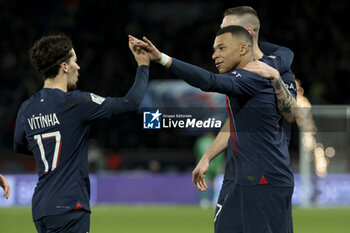 2023-12-20 - Kylian Mbappe of PSG celebrates his first goal with Vitinha (left) during the French championship Ligue 1 football match between Paris Saint-Germain and FC Metz on December 20, 2023 at Parc des Princes stadium in Paris, France - FOOTBALL - FRENCH CHAMP - PARIS SG V METZ - FRENCH LIGUE 1 - SOCCER