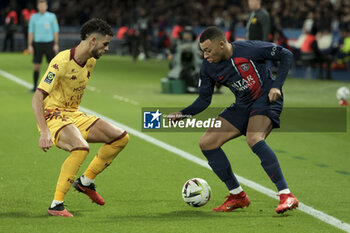 2023-12-20 - Kylian Mbappe of PSG, left Kevin Van Den Kerkhof of Metz during the French championship Ligue 1 football match between Paris Saint-Germain and FC Metz on December 20, 2023 at Parc des Princes stadium in Paris, France - FOOTBALL - FRENCH CHAMP - PARIS SG V METZ - FRENCH LIGUE 1 - SOCCER