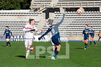 2023-01-15 - Julie Piga of FC Fleury 91 and Mathilde Bourdieu of Paris FC fight for the ball during the Women's French championship D1 Arkema football match between Paris FC and FC Fleury 91 on January 15, 2023 at Sebastien Charlety stadium in Paris, France - FOOTBALL - WOMEN'S FRENCH CHAMP - PARIS FC V FC FLEURY - FRENCH WOMEN DIVISION 1 - SOCCER