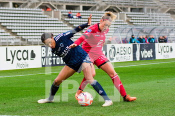 2023-02-04 - Eseosa Aigbogun of Paris FC and Maria Diaz of Dijon FCO fight for the ball during the Women's French championship, D1 Arkema football match between Paris FC and Dijon FCO on February 4, 2023 at Sebastien Charlety stadium in Paris, France - FOOTBALL - WOMEN'S FRENCH CHAMP - PARIS FC V DIJON - FRENCH WOMEN DIVISION 1 - SOCCER