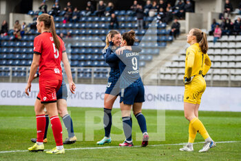 2023-02-04 - Louise Fleury of Paris FC and Mathilde Bourdieu of Paris FC celebrate the goal during the Women's French championship, D1 Arkema football match between Paris FC and Dijon FCO on February 4, 2023 at Sebastien Charlety stadium in Paris, France - FOOTBALL - WOMEN'S FRENCH CHAMP - PARIS FC V DIJON - FRENCH WOMEN DIVISION 1 - SOCCER